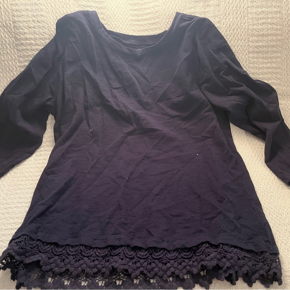 I’m selling a blue long sleeve with floral accents on the bottom